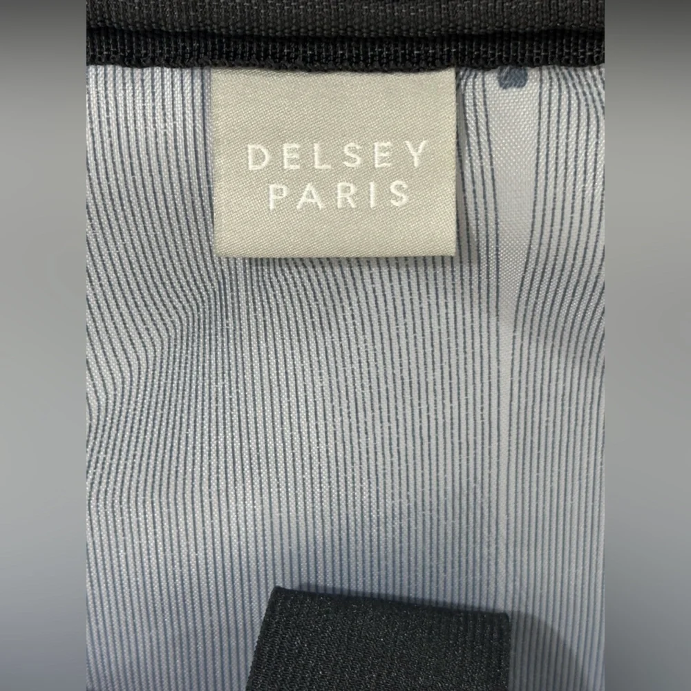 Delsey paris Rolling Carry-On Briefcase in Dark Green with Telescopic Handle